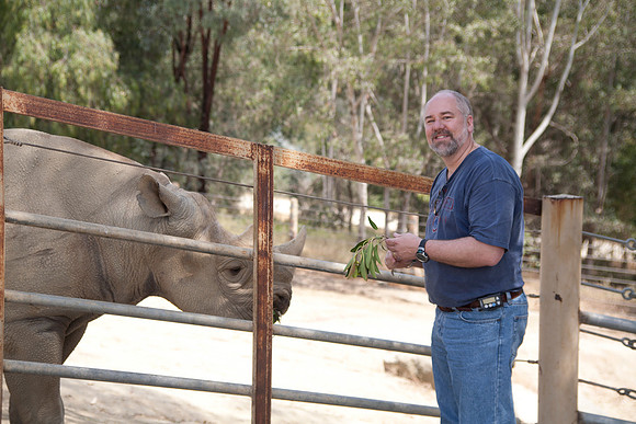 Dan Feeding an African Southern White Rhinoceros, San Diego Wild Animal Park, Escondido, CA (2010)