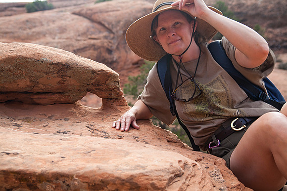 Sheryl Finds a Mini Arch, Devil's Garden, Arches National Park, UT (2010)