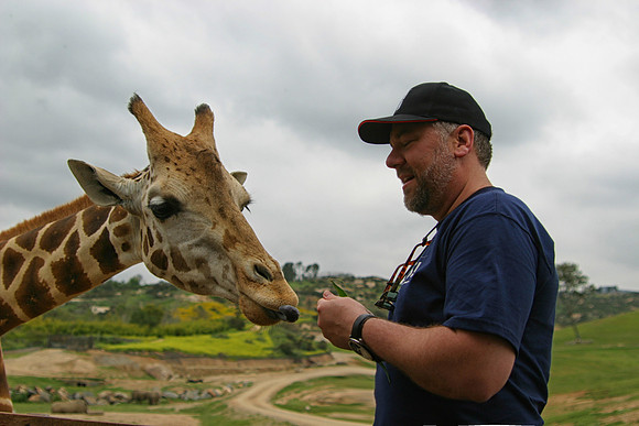 Dan Feeding Masai Giraffe, San Diego Wild Animal Park, Escondido, CA (2006)